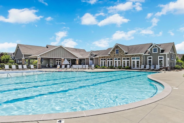 view of swimming pool with a patio