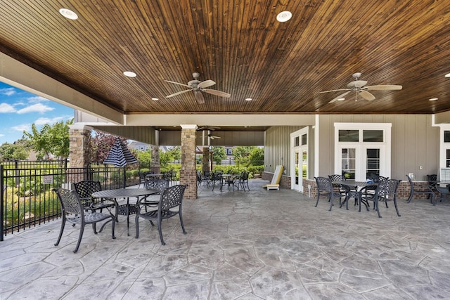 view of patio / terrace featuring ceiling fan and french doors