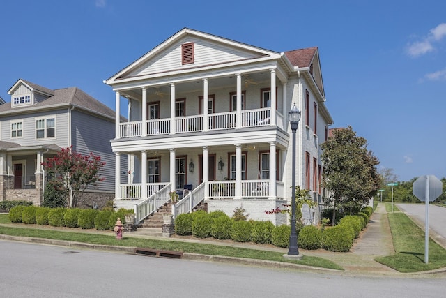 neoclassical / greek revival house with a porch and a balcony