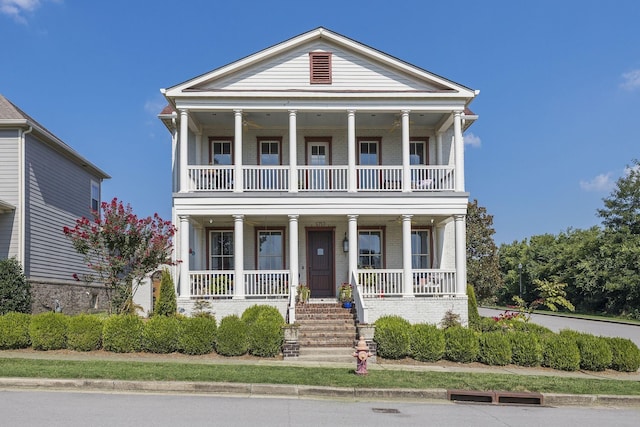 neoclassical / greek revival house with a porch and a balcony