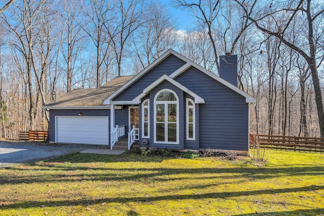 view of front facade with a garage and a front lawn