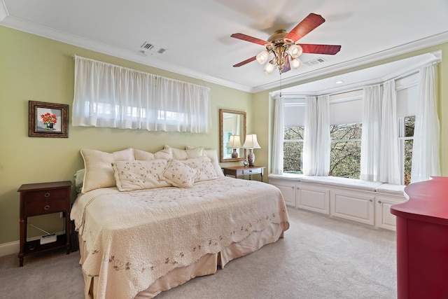 bedroom featuring light colored carpet, ceiling fan, and ornamental molding