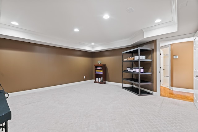 basement featuring carpet floors and crown molding