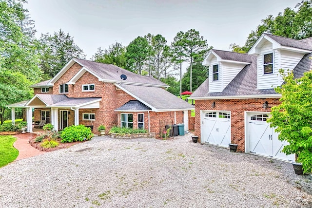 view of front facade featuring a porch and a garage