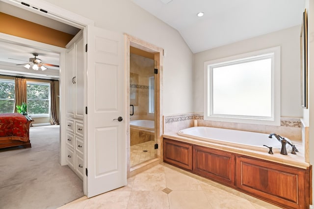 bathroom with tile patterned flooring, ceiling fan, lofted ceiling, and plus walk in shower