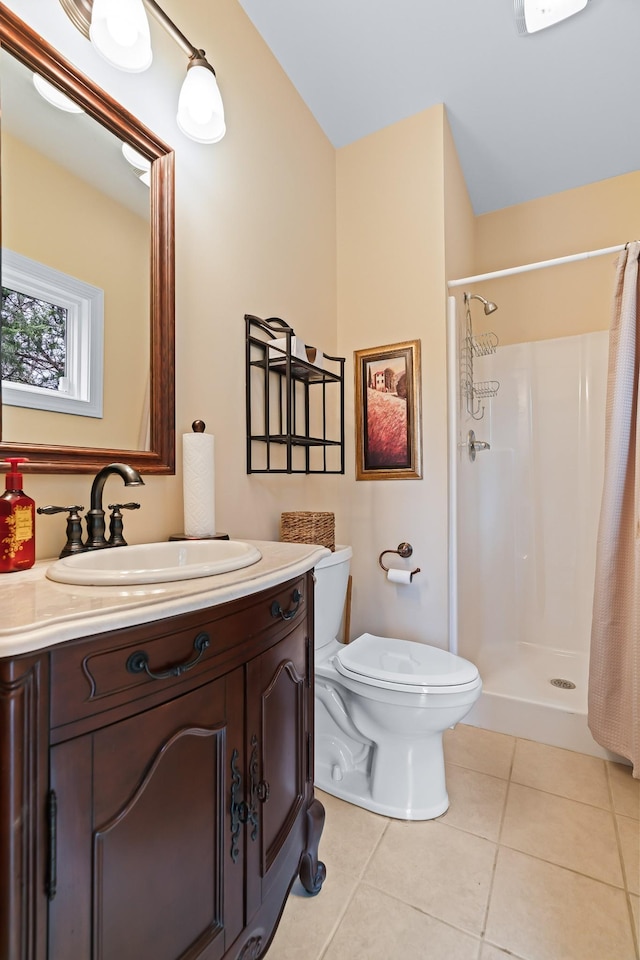 bathroom with tile patterned floors, vanity, curtained shower, and toilet