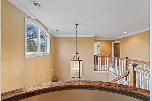 interior space featuring crown molding and an inviting chandelier