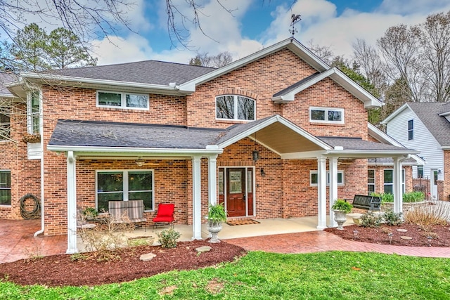 back of property featuring a patio