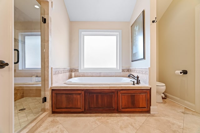 bathroom featuring tile patterned floors, plenty of natural light, toilet, and independent shower and bath