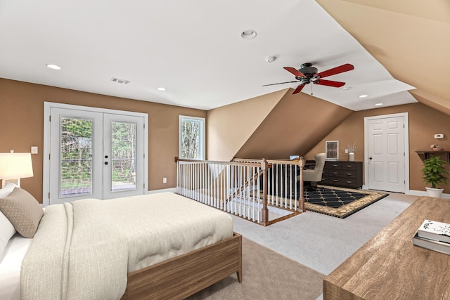 bedroom featuring french doors, vaulted ceiling, ceiling fan, access to exterior, and light colored carpet