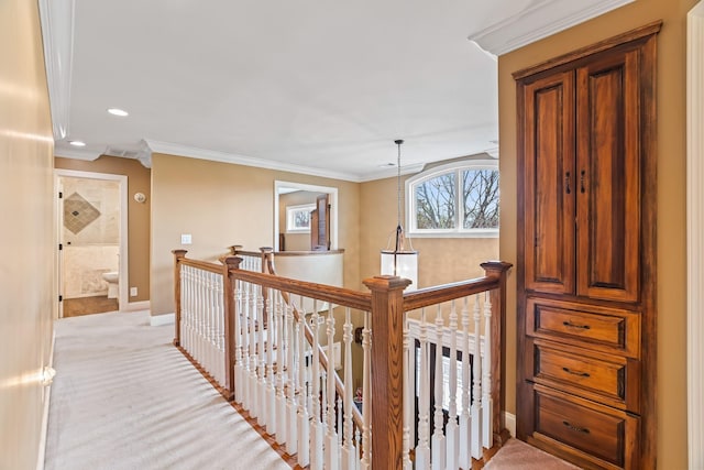 hall featuring light carpet and ornamental molding