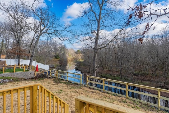 deck featuring fence private yard and a vegetable garden