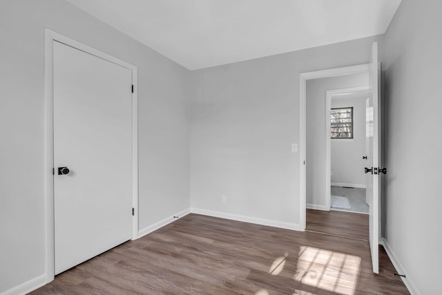 unfurnished room featuring hardwood / wood-style floors