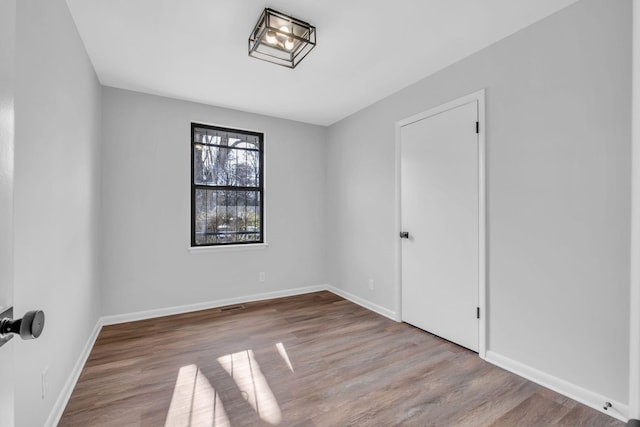 unfurnished room featuring light hardwood / wood-style flooring