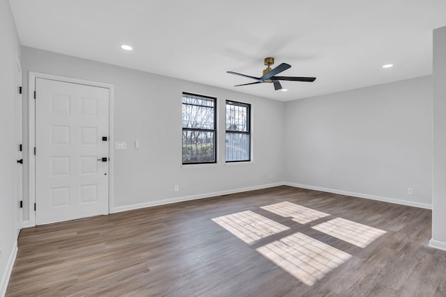 interior space with ceiling fan and dark wood-type flooring