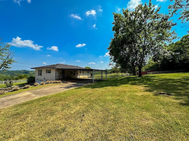 view of yard featuring a rural view and a carport