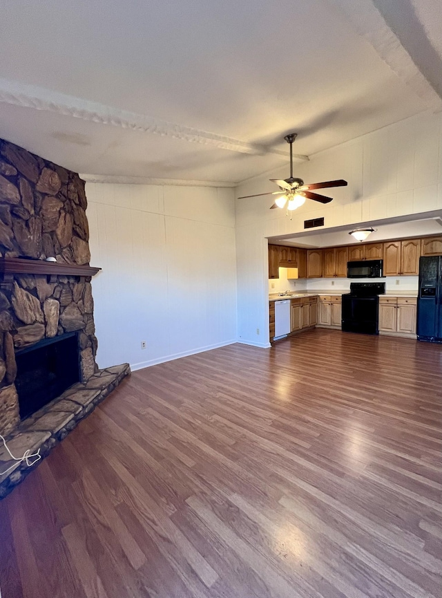 unfurnished living room with a fireplace and dark hardwood / wood-style floors