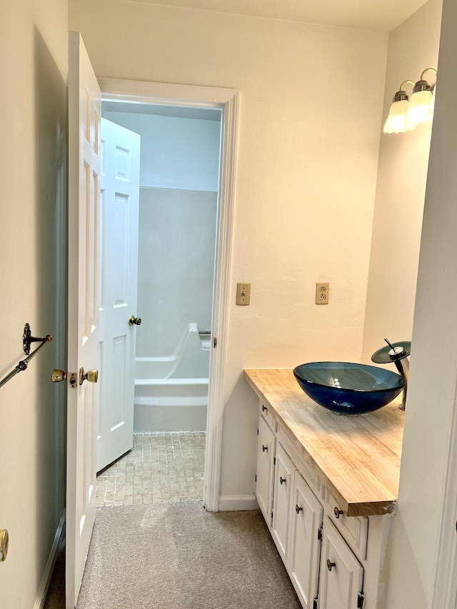 bathroom with vanity and a bathing tub