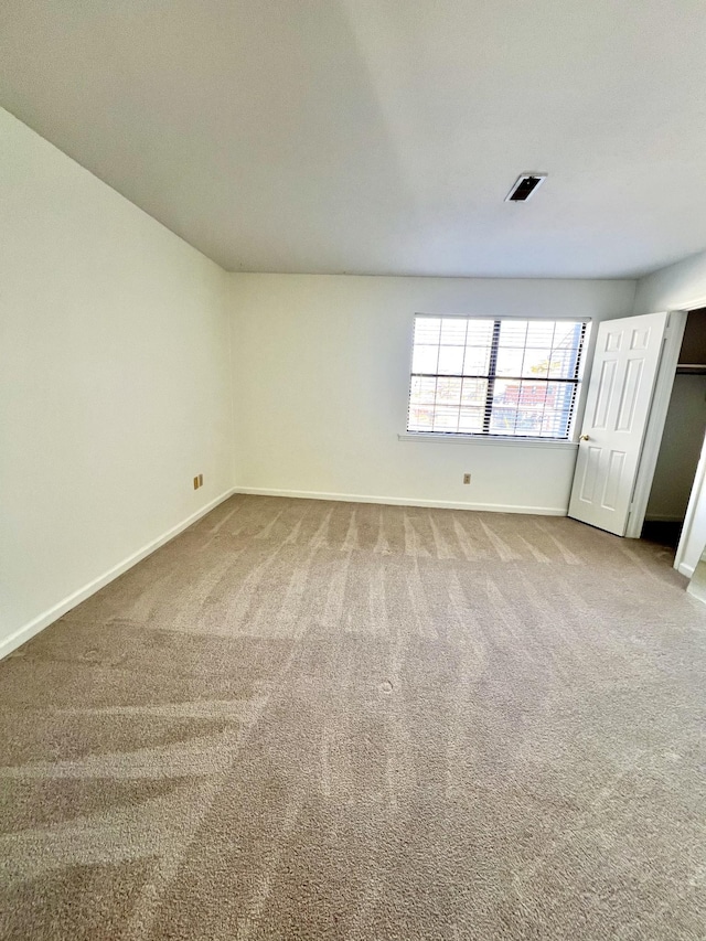 view of carpeted spare room