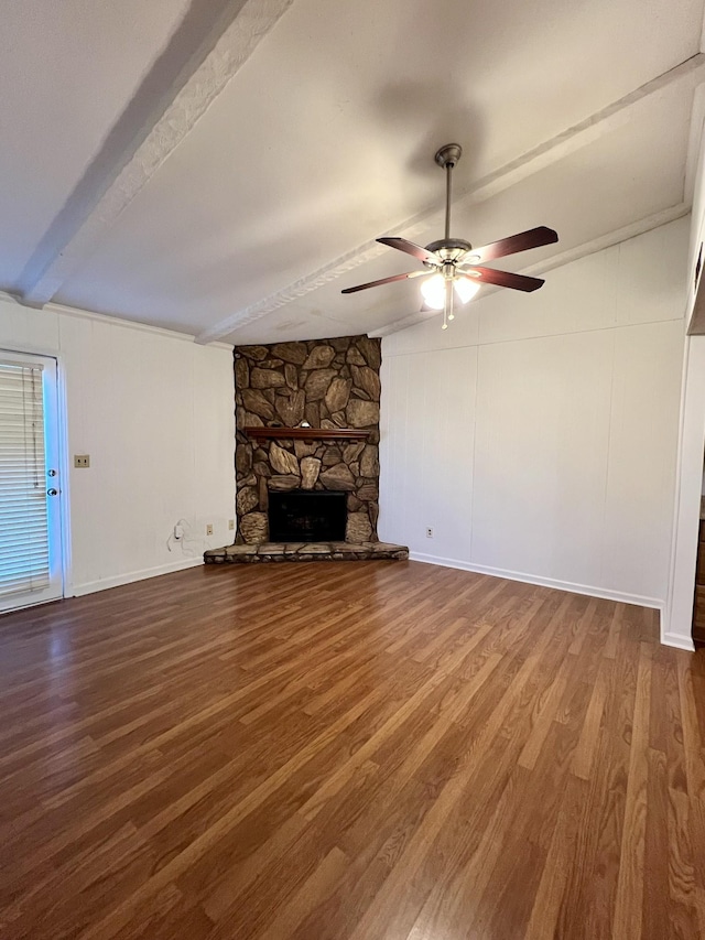 unfurnished living room featuring ceiling fan, a fireplace, beamed ceiling, and wood-type flooring