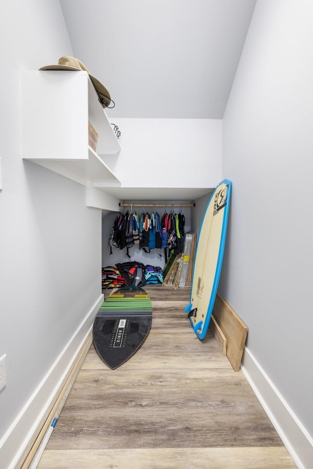 spacious closet with light hardwood / wood-style floors