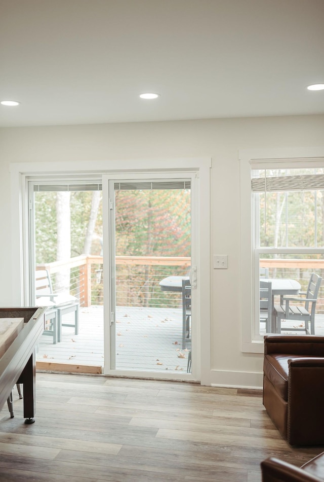 doorway to outside with light hardwood / wood-style floors