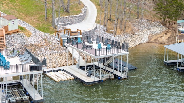 view of dock featuring a deck with water view