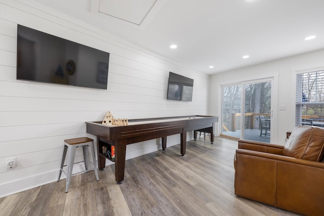 rec room with a healthy amount of sunlight and light hardwood / wood-style floors