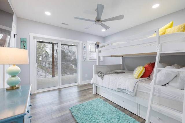 bedroom featuring ceiling fan, access to exterior, and wood-type flooring