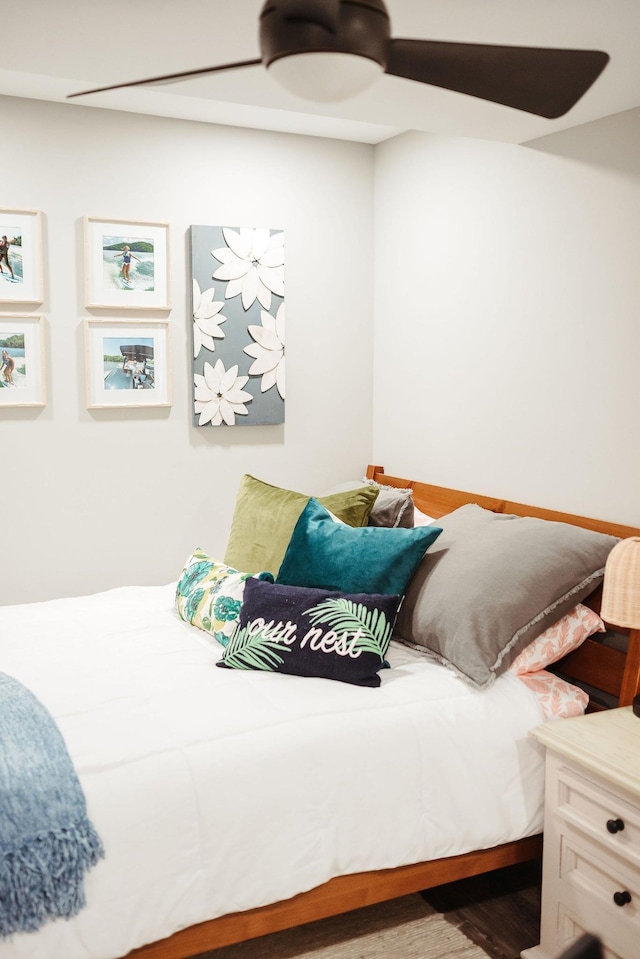 bedroom with wood-type flooring and ceiling fan