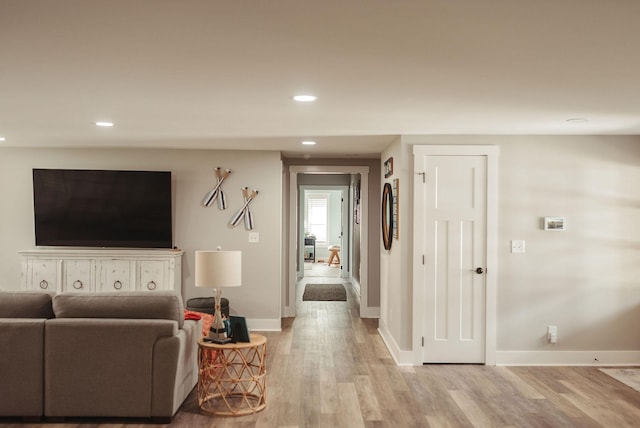 living room with light hardwood / wood-style flooring