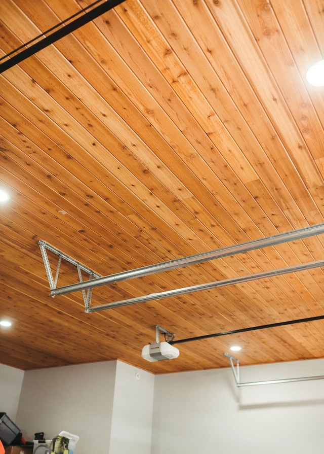 room details featuring wood ceiling and a garage door opener