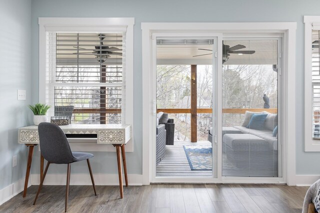 entryway with baseboards, ceiling fan, and wood finished floors