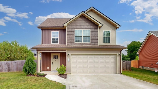 front of property with a front yard and a garage