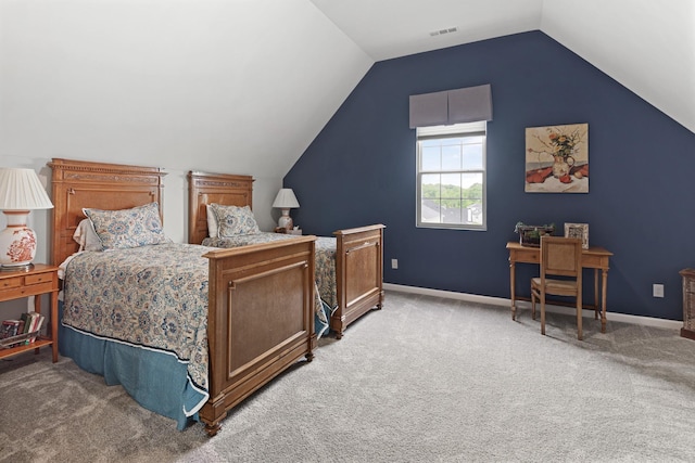 bedroom with carpet and lofted ceiling