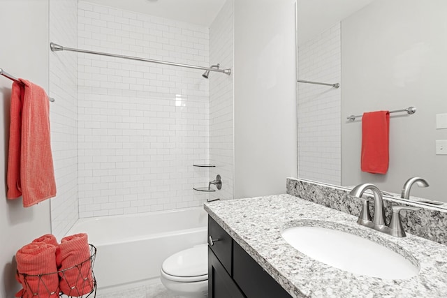 full bathroom with vanity, toilet, and tiled shower / bath