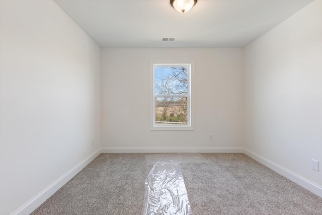 spare room with light carpet