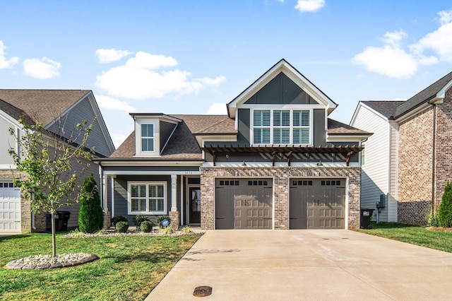 view of front of property with a front yard and a garage