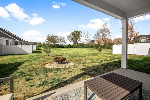 view of yard featuring a patio and an outdoor fire pit