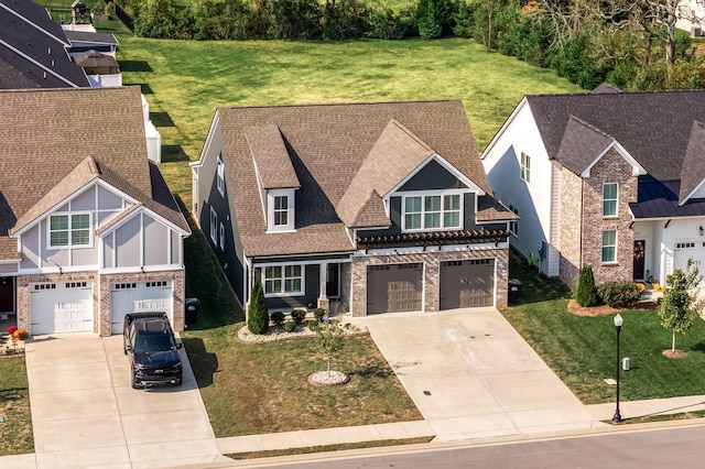 view of front facade featuring a front yard and a garage