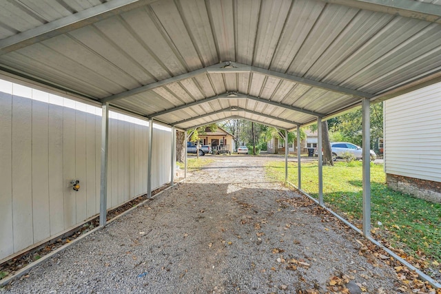 view of parking with a detached carport