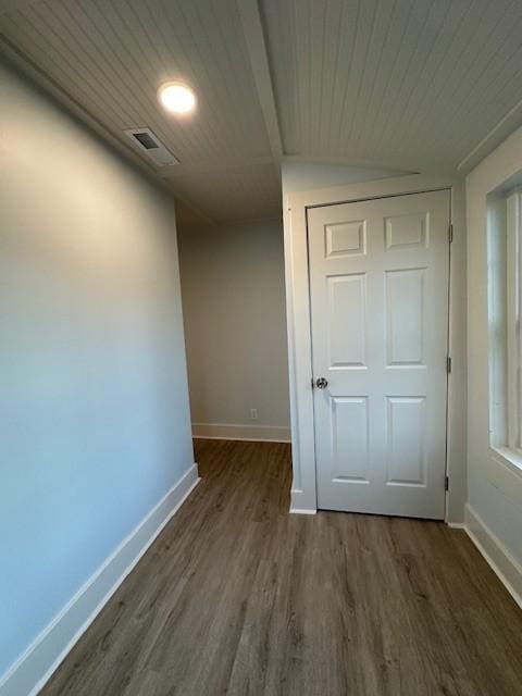 interior space with wooden ceiling, baseboards, and dark wood-type flooring