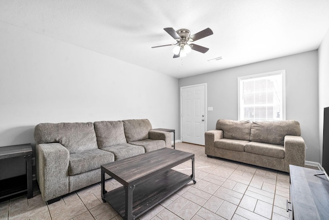 living room with ceiling fan and light tile patterned floors