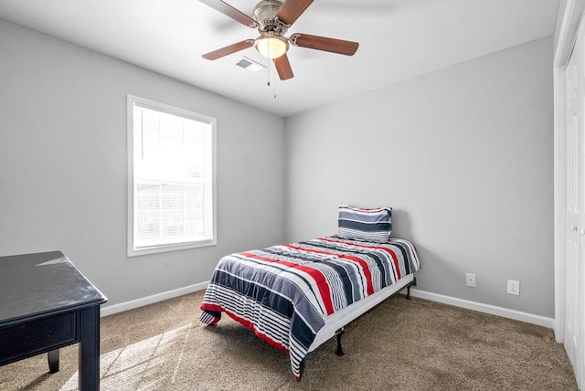 carpeted bedroom with ceiling fan