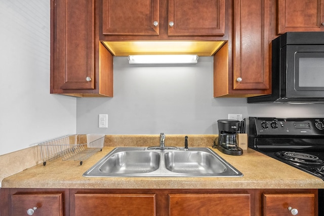 kitchen with black appliances and sink