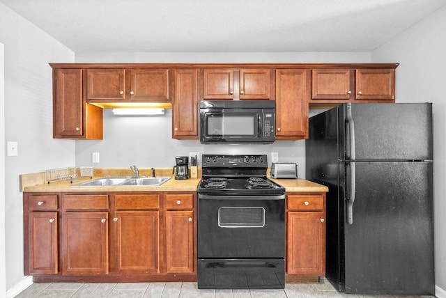 kitchen with sink and black appliances