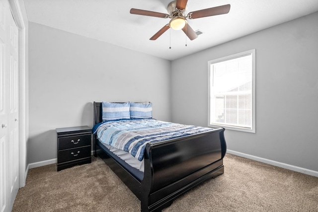 bedroom with carpet, a closet, and ceiling fan
