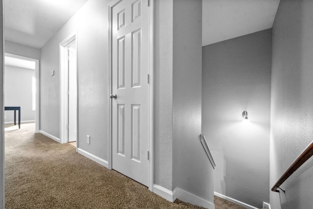 hall with carpet floors