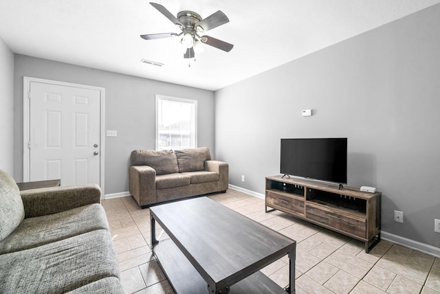 tiled living room with ceiling fan