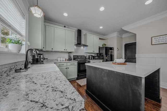 kitchen featuring black appliances, wall chimney range hood, sink, a kitchen island, and dark hardwood / wood-style flooring